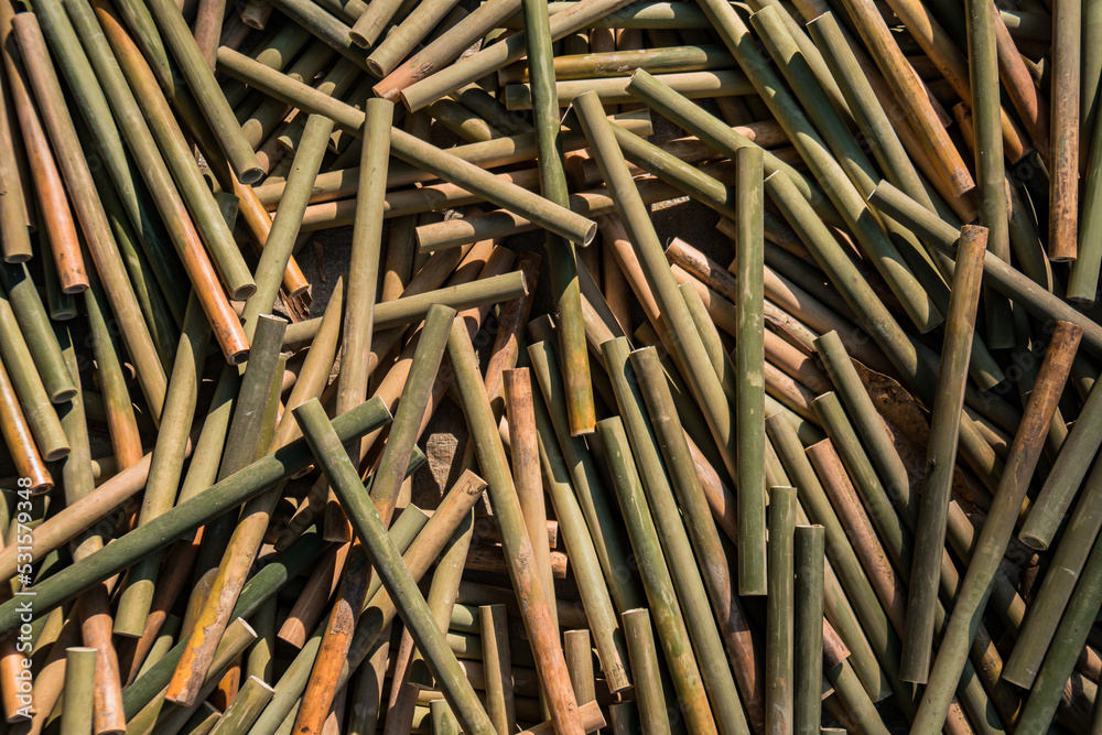 A pile of semi-finished bamboo pieces that will become a bamboo flute craft, the production process of this bamboo flute craft is done by hand by craftsmen A pile of semi-finished bamboo pieces that will become a bamboo flute craft, the production process of this bamboo flute craft is done by hand by craftsmen