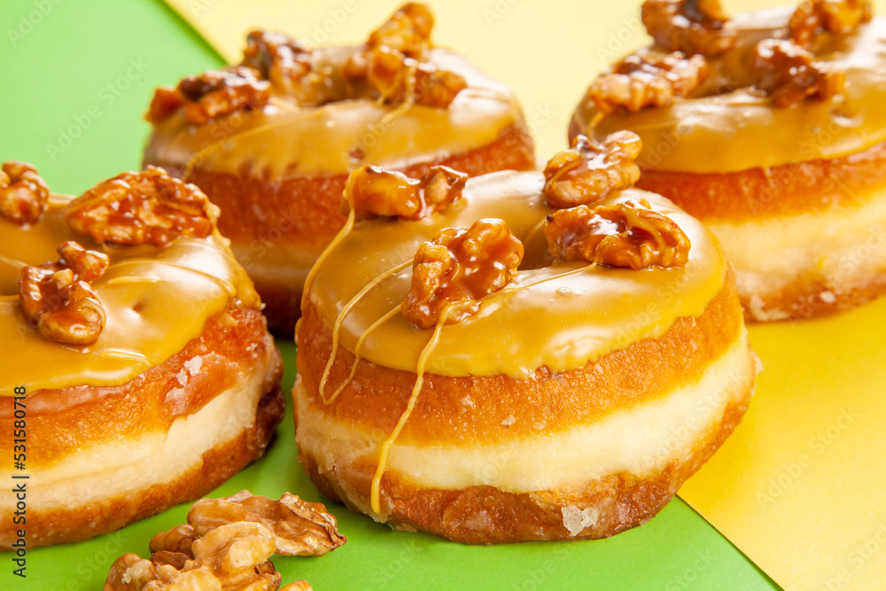 Walnut flavoured caramelised gourmet brioche doughnuts closeup. Walnut flavoured caramelised gourmet brioche doughnuts closeup.