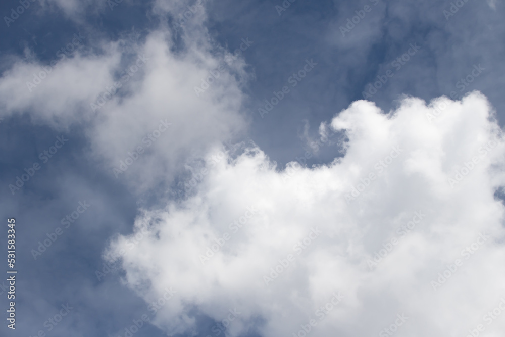 White large clouds against the blue sky.