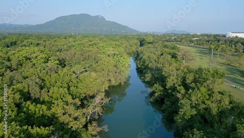 Rio Munoz Flowing Between Lush Green Forest In Puerto Plata, Dominican Republic. - aerial photo