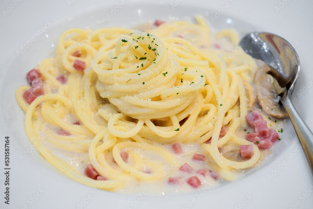 Spaghetti Carbonara Italian cuisine on white dish Spaghetti Carbonara Italian cuisine on white dish