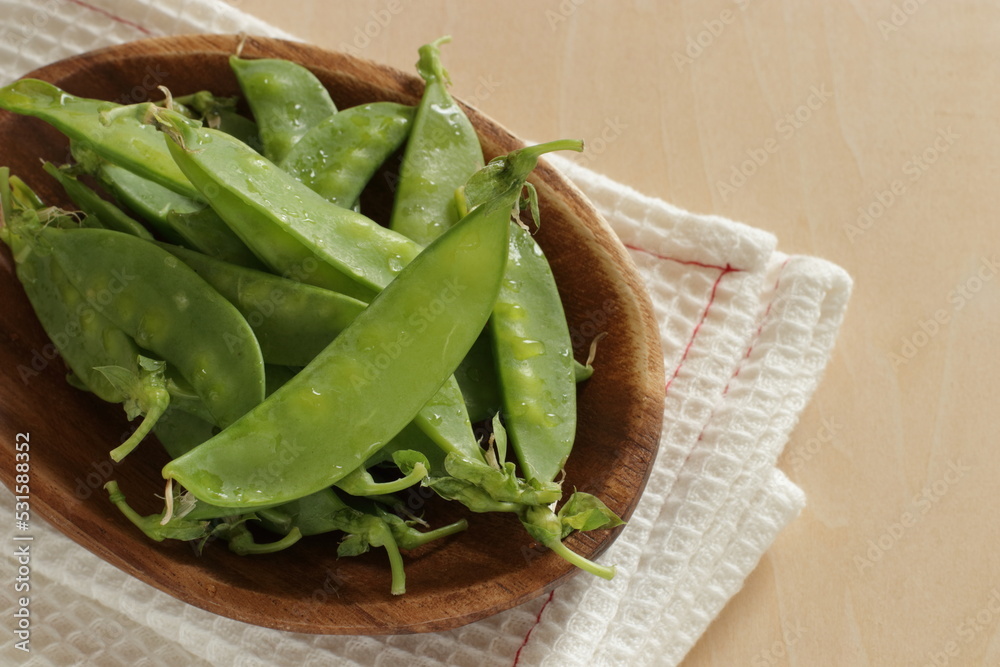 Freshness pea on wooden plate for cooking image Freshness pea on wooden plate for cooking image