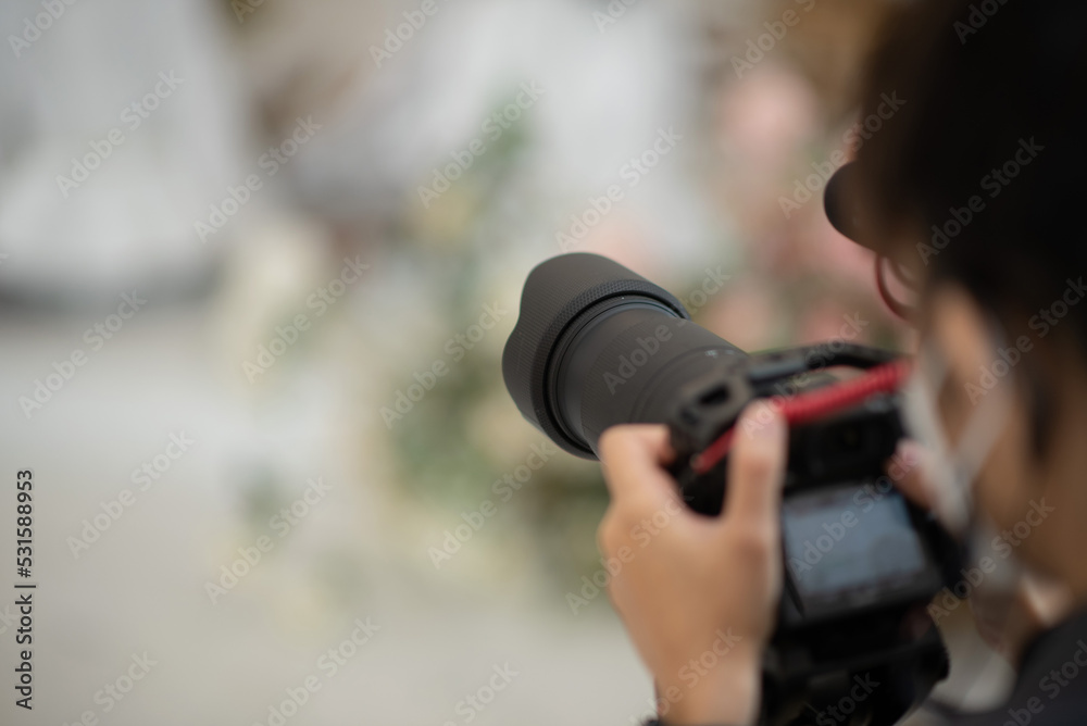 Obraz premium videographer close up, cameraman, man with camera, movie,