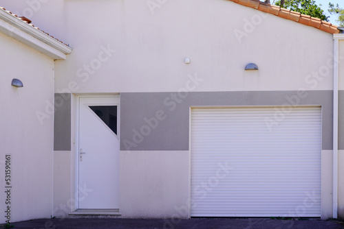 facade white door pvc gate garage plastic portal of suburb house with two entrance garage home door