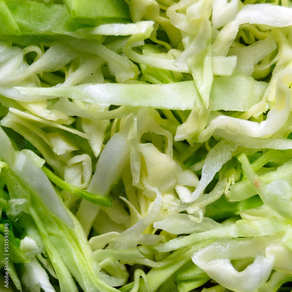 sliced cabbage close-up. cabbage salad. source of vitamins. Square image. sliced cabbage close-up. cabbage salad. source of vitamins. Square image.