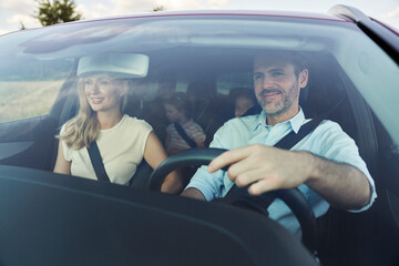 Caucasian family trip driving at the car