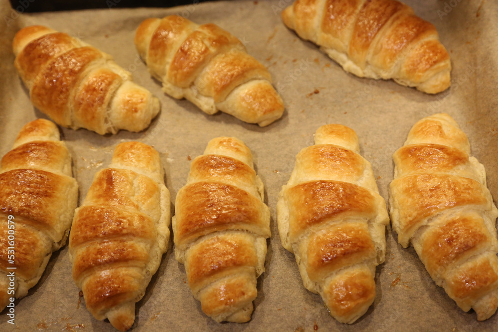 Close up photo of fresh butter croissants from oven