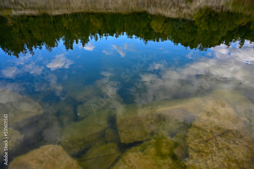 calm water surface in old Swedish quarry © Jonas