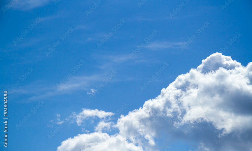 Summer sky. Cumulus clouds on a blue background. Partly cloudy. Summer sky. Cumulus clouds on a blue background. Partly cloudy.