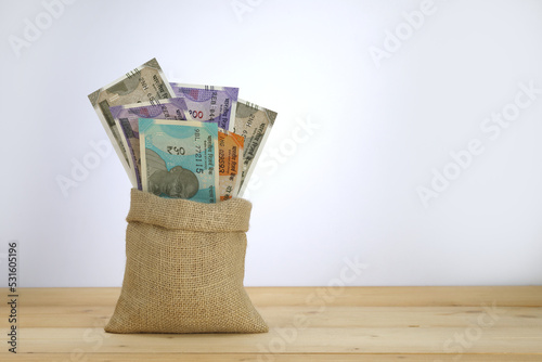 Indian currency notes in a jute sack.