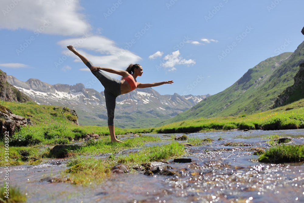 Woman in nature dancing ballet alone