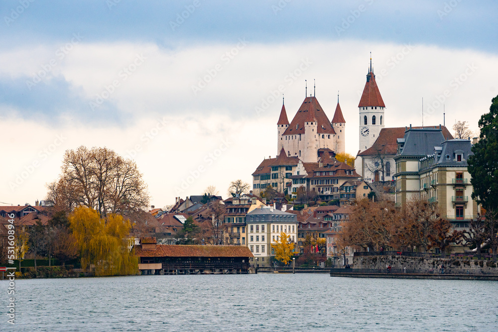 Fototapeta premium Thun castle , museum and Swiss heritage site in old town of Thun , Aare lake during autumn , winter cloudy day : Thun , Switzerland : December 2 , 2019