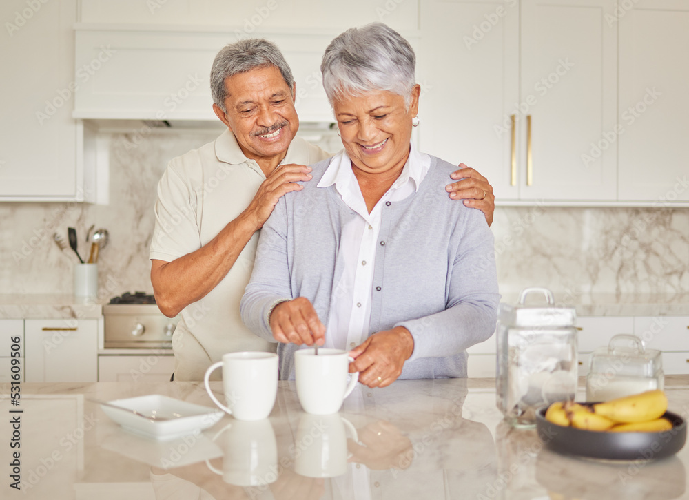 Coffee, couple and love with a senior woman and man enjoying retirement while together in the kitchen of their home. Happy, smile and romance with an elderly male and female pensioner making tea Coffee, couple and love with a senior woman and man enjoying retirement while together in the kitchen of their home. Happy, smile and romance with an elderly male and female pensioner making tea