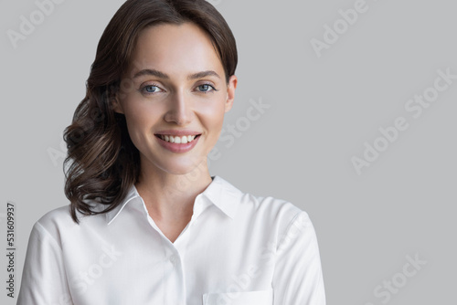 Beautiful young business woman portrait, Smiling cute girl with long hair studio shot, Isolated on gray background Free Download Beautiful young business woman portrait, Smiling cute girl with long hair studio shot, Isolated on gray background - GFXLoad