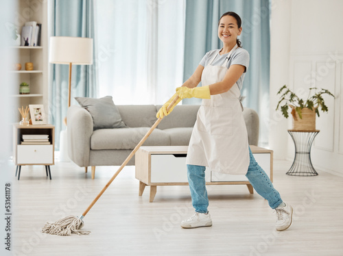 Asian cleaner woman mopping and cleaning dirt and dust in lounge or living room floor in house or home. Happy Japanese housekeeping help, hygiene maid or employee tidy and spring cleaning apartment