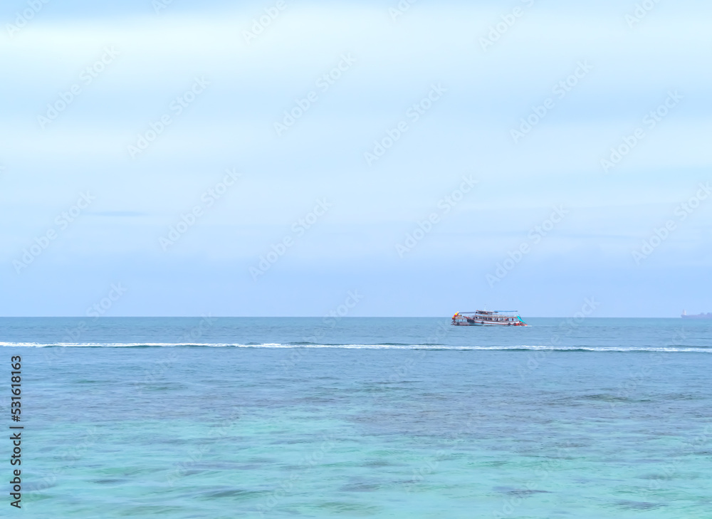 Blue Sea and Blue Sky Background at Coast,Beautiful Texture Wavy white Foam Blue Ocean Coastline,Sandy with Sea Nature,Transparent Water Seascape Island Photography,Vacation Tropical Summer. Blue Sea and Blue Sky Background at Coast,Beautiful Texture Wavy white Foam Blue Ocean Coastline,Sandy with Sea Nature,Transparent Water Seascape Island Photography,Vacation Tropical Summer.