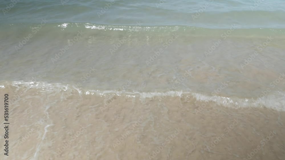 turquoise sea water waves hit the white sand smooth beach in daytime, natural landscape sea for holiday vacation summer background turquoise sea water waves hit the white sand smooth beach in daytime, natural landscape sea for holiday vacation summer background