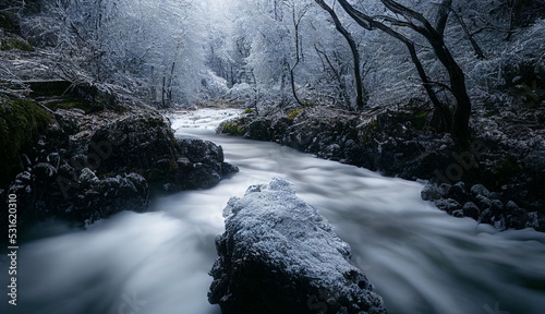 Beautiful forest ice stream and river. Fantastic Epic Magical Landscape. Autumn and winter nature. Celtic Medieval Forest. Rocks and grass. 