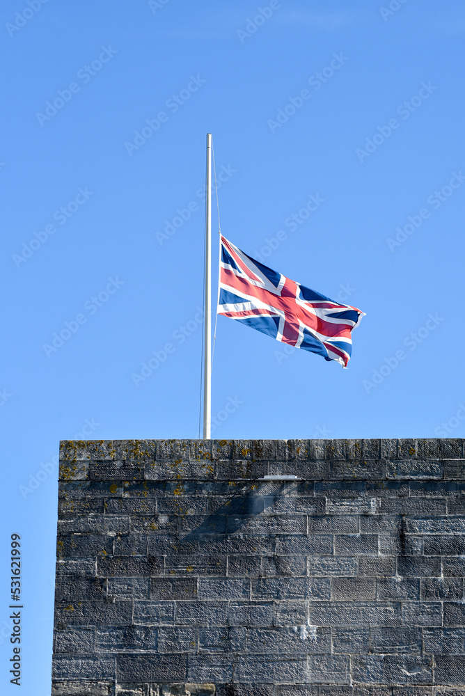 British union jack flag at half mast as a gesture of respect for the passing of Queen Elizabeth 2nd