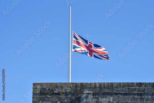 British union jack flag at half mast as a gesture of respect for the passing of Queen Elizabeth 2nd photo