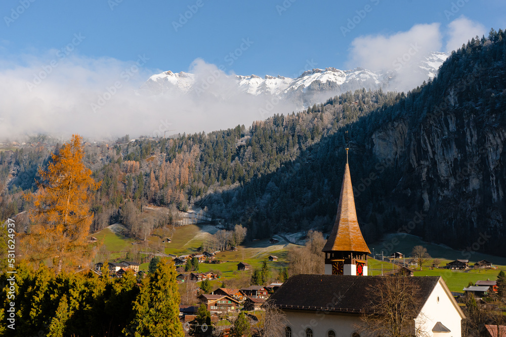 Lauterbrunnen , Picturesque villages , town and valleys of Alps . Nice Staubbach Falls , Kirche , nature during autumn, winter : Lauterbrunnen , Switzerland : December 3 , 2019