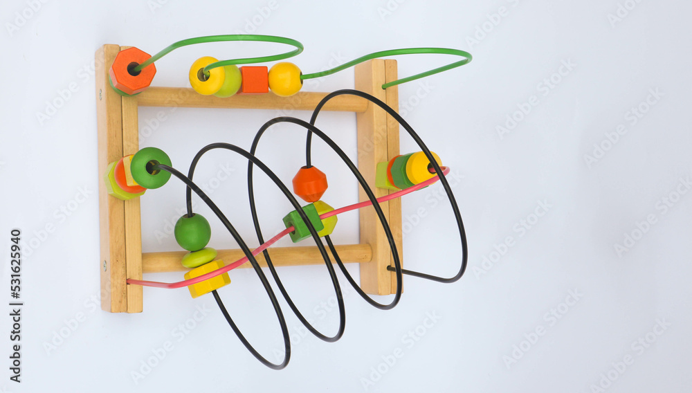Colorful wooden bead roller coaster toy on white background Colorful wooden bead roller coaster toy on white background