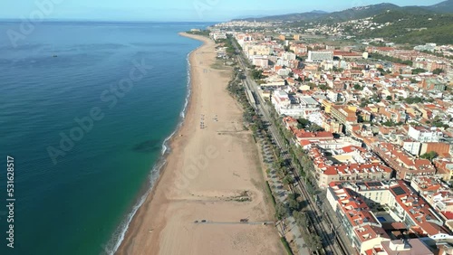 Aerial image of Malgrat de Mar beach in the province of Barcelona beach without people transparent turquoise blue sea photo