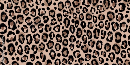 Seamless painted jaguar, leopard, cheetah, panther skin pattern. Animal beige and brown background with small spots