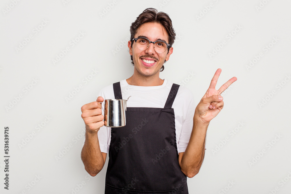 Young hispanic barista man isolated on white background showing number two with fingers. Young hispanic barista man isolated on white background showing number two with fingers.