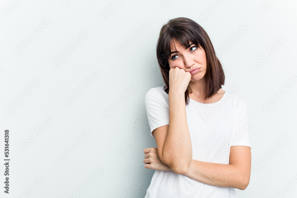 Young caucasian woman isolated on white background who feels sad and pensive, looking at copy space. Young caucasian woman isolated on white background who feels sad and pensive, looking at copy space.