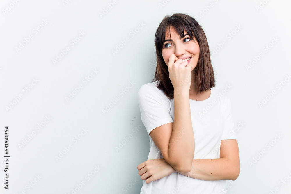 Young caucasian woman isolated on white background relaxed thinking about something looking at a copy space. Young caucasian woman isolated on white background relaxed thinking about something looking at a copy space.