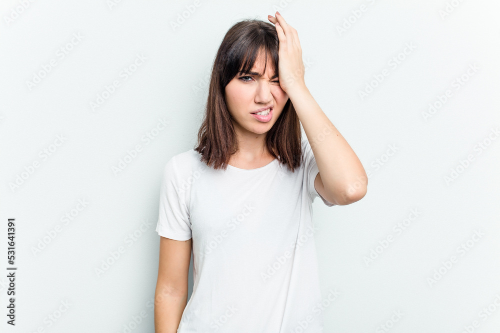Young caucasian woman isolated on white background forgetting something, slapping forehead with palm and closing eyes. Young caucasian woman isolated on white background forgetting something, slapping forehead with palm and closing eyes.