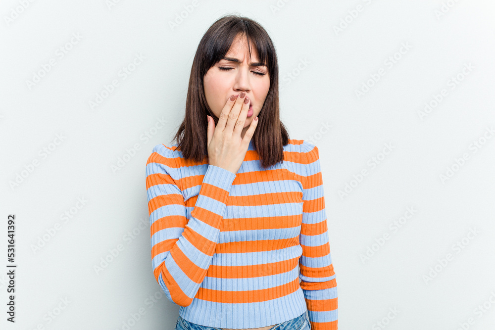 Young caucasian woman isolated on white background yawning showing a tired gesture covering mouth with hand. Young caucasian woman isolated on white background yawning showing a tired gesture covering mouth with hand.