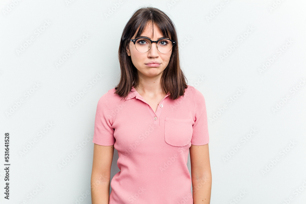 Young caucasian woman isolated on white background sad, serious face, feeling miserable and displeased.