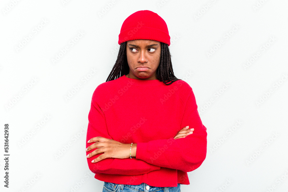 Young African American woman isolated on white background tired of a repetitive task. Young African American woman isolated on white background tired of a repetitive task.