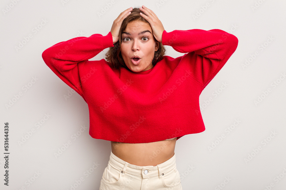 Young caucasian woman isolated on blue background being shocked, she has remembered important meeting. Young caucasian woman isolated on blue background being shocked, she has remembered important meeting.