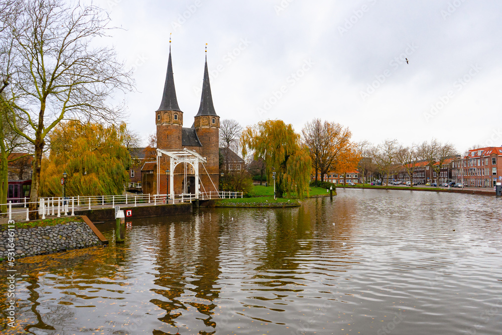 The Eastern gate in Delft , Brick Gothic northern European architecture gate and towers during autumn , winter : Delft , Netherlands : November 28 , 2019 The Eastern gate in Delft , Brick Gothic northern European architecture gate and towers during autumn , winter : Delft , Netherlands : November 28 , 2019