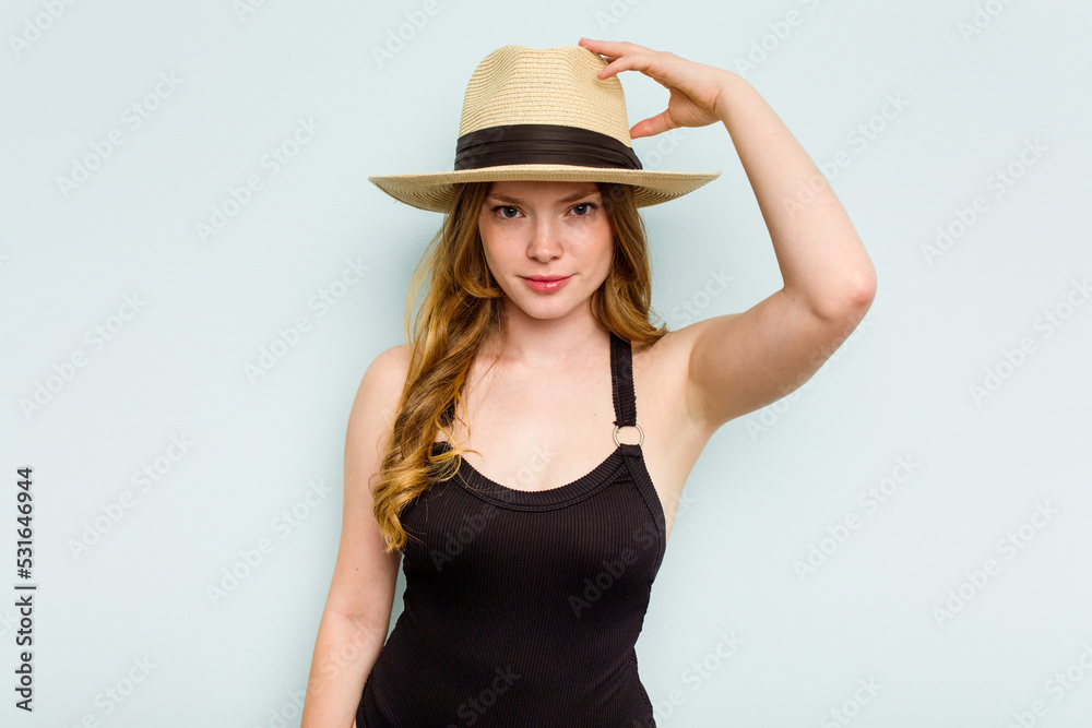 Young caucasian woman going to the beach isolated on blue background being shocked, she has remembered important meeting. Young caucasian woman going to the beach isolated on blue background being shocked, she has remembered important meeting.