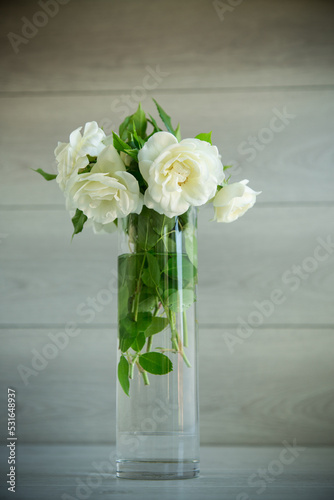 bouquet of beautiful white roses on table