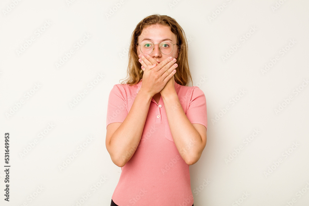 Young caucasian woman isolated on white background shocked covering mouth with hands. Young caucasian woman isolated on white background shocked covering mouth with hands.