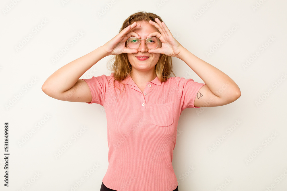 Young caucasian woman isolated on white background showing okay sign over eyes Young caucasian woman isolated on white background showing okay sign over eyes