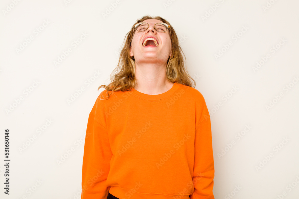 Young caucasian woman isolated on white background relaxed and happy laughing, neck stretched showing teeth. Young caucasian woman isolated on white background relaxed and happy laughing, neck stretched showing teeth.