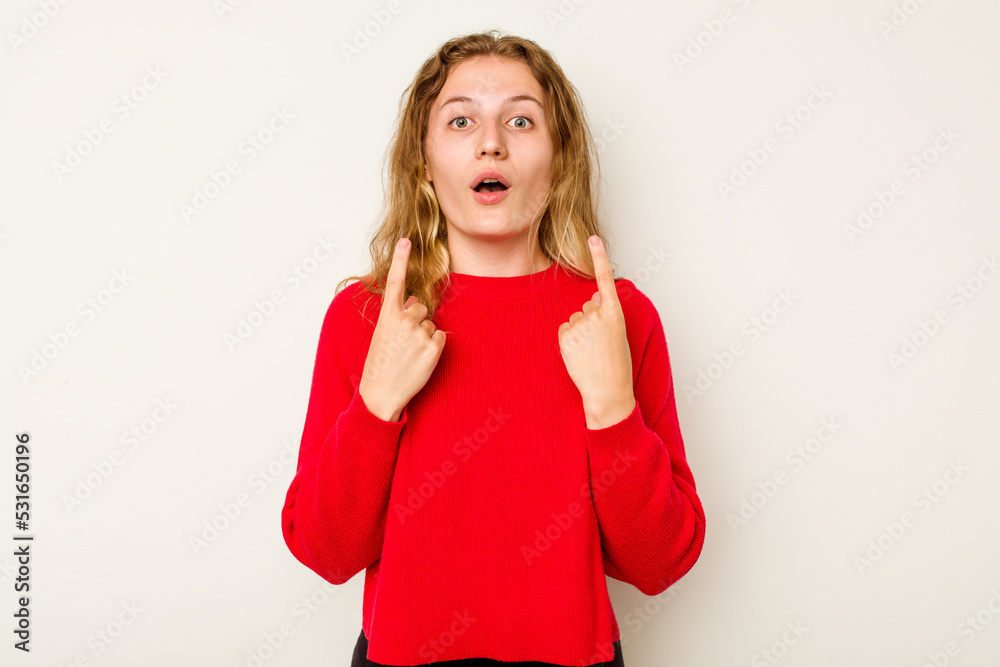 Fototapeta premium Young caucasian woman isolated on white background pointing upside with opened mouth.
