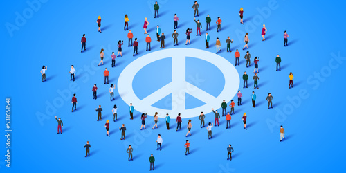 Large group of people stand around the peace symbol.