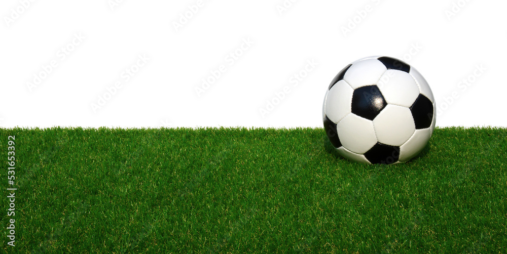 Soccer ball on green sports floor isolated on white