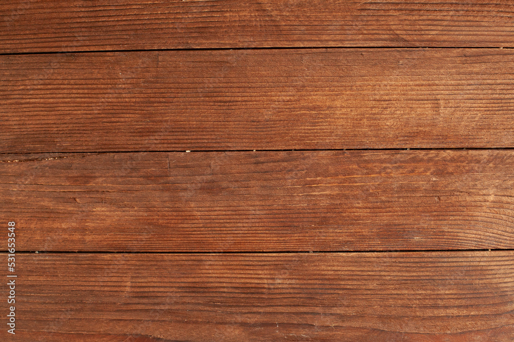 Fototapeta premium Vintage brown wood background texture with knots and nail holes. Old painted wood wall. Brown abstract background. Vintage wooden dark horizontal boards. Front view with copy space. Background for des