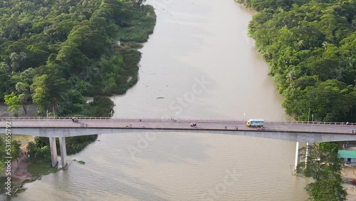 zoom out view of the Gabkhan bridge as traffic flows over river photo