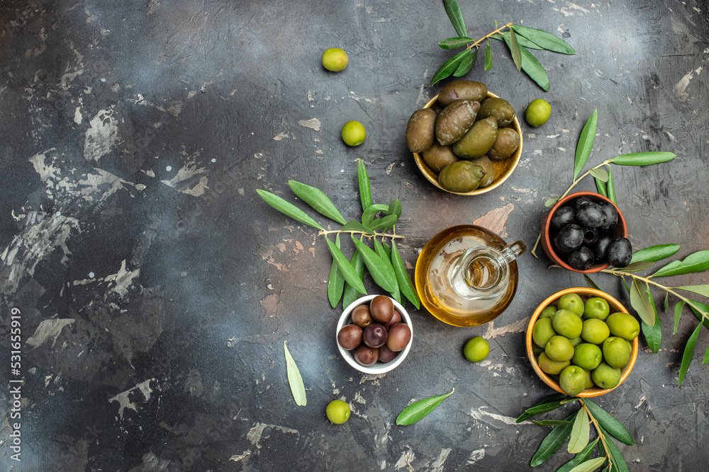 Different Types Of Olives In Olive Bowls And Olive Oil On A Dark Background Olive Concept Different Types Of Olives In Olive Bowls And Olive Oil On A Dark Background Olive Concept