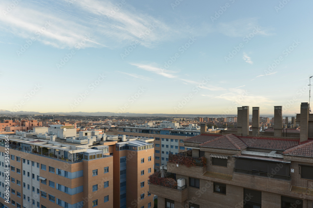 Views of facades and roofs of the city on an autumn day