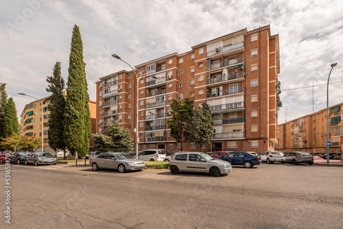 Facades of urban residential houses in beehive street view